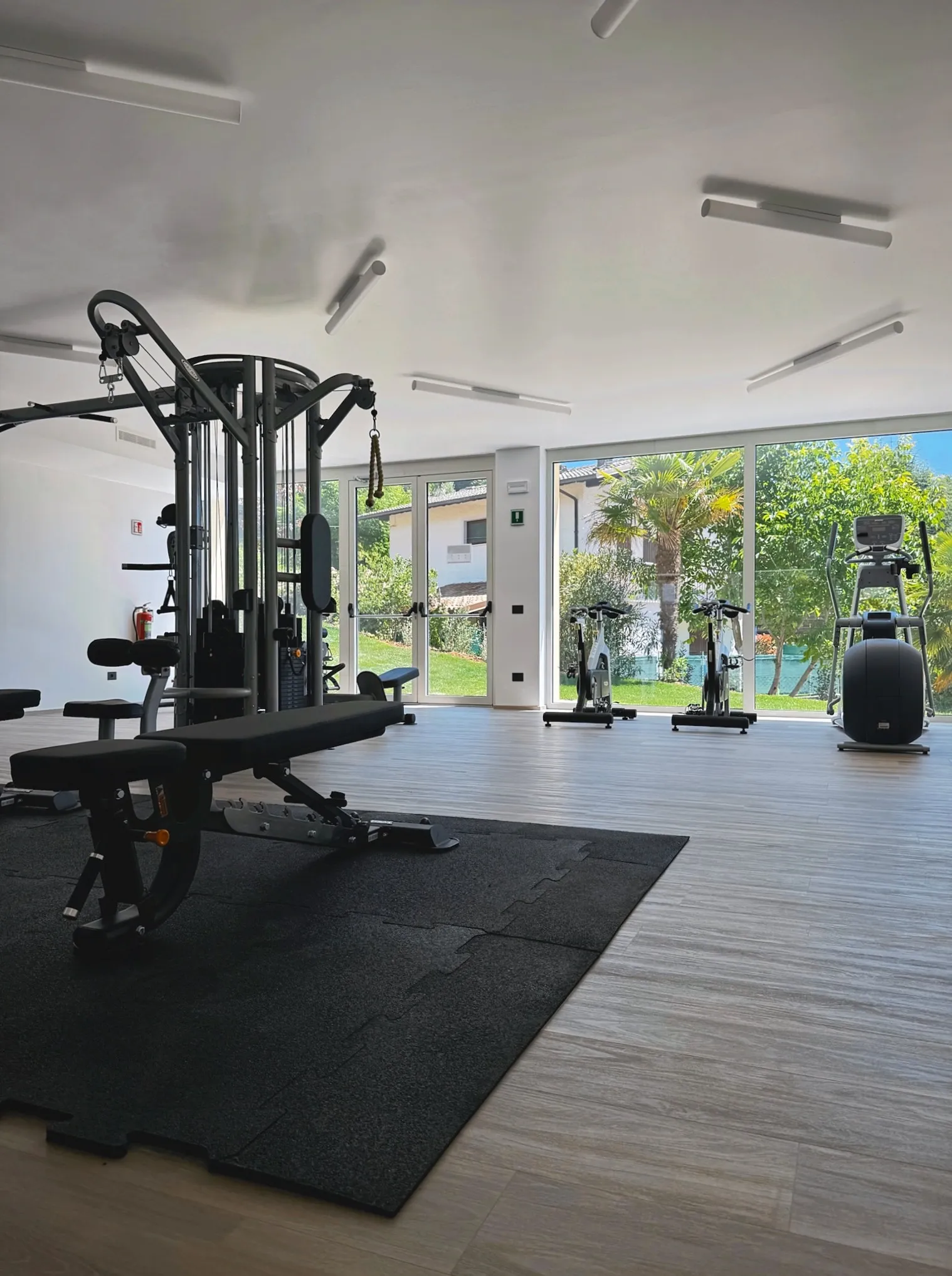 Gym – overview with cardio machines and garden view
